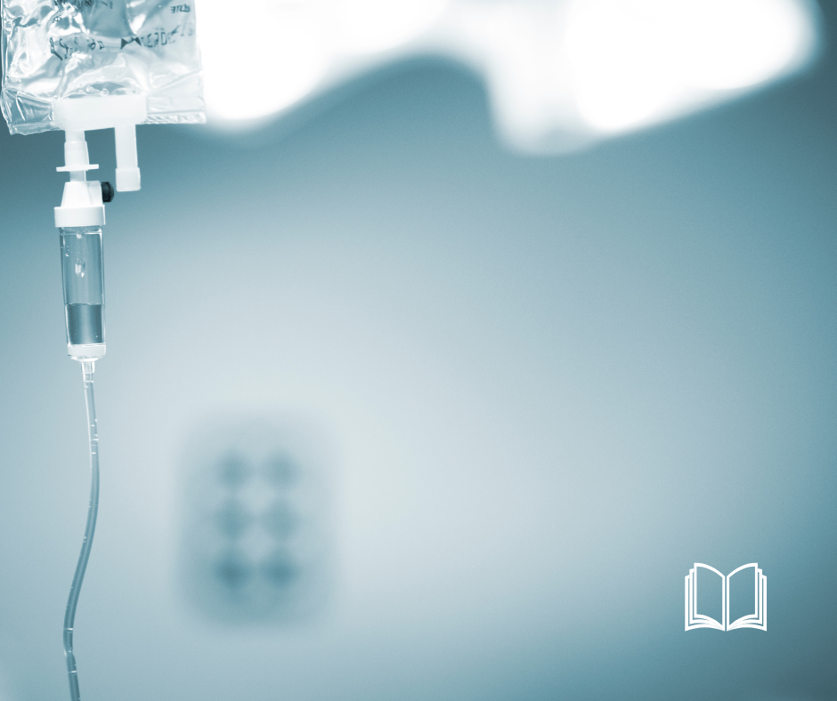 A single IV bag against a gray hospital background.