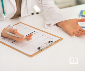 A doctor's hand at a white desk overlooking a patient's chart.