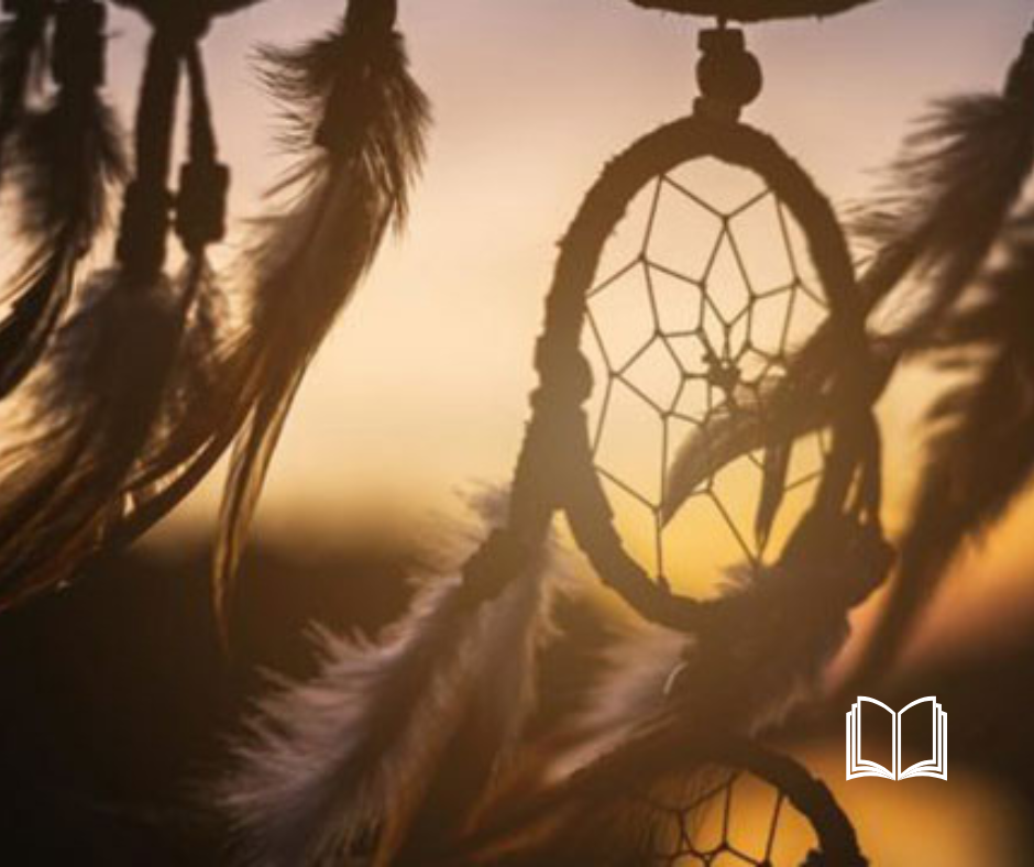 Dreamcatcher hanging with a sunset background.