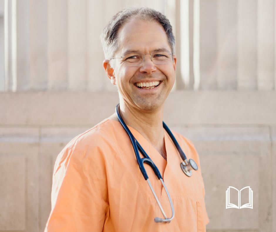 Prof. Dr. Jan Bonhoeffer smiling wearing orange scrubs and a stethoscope.