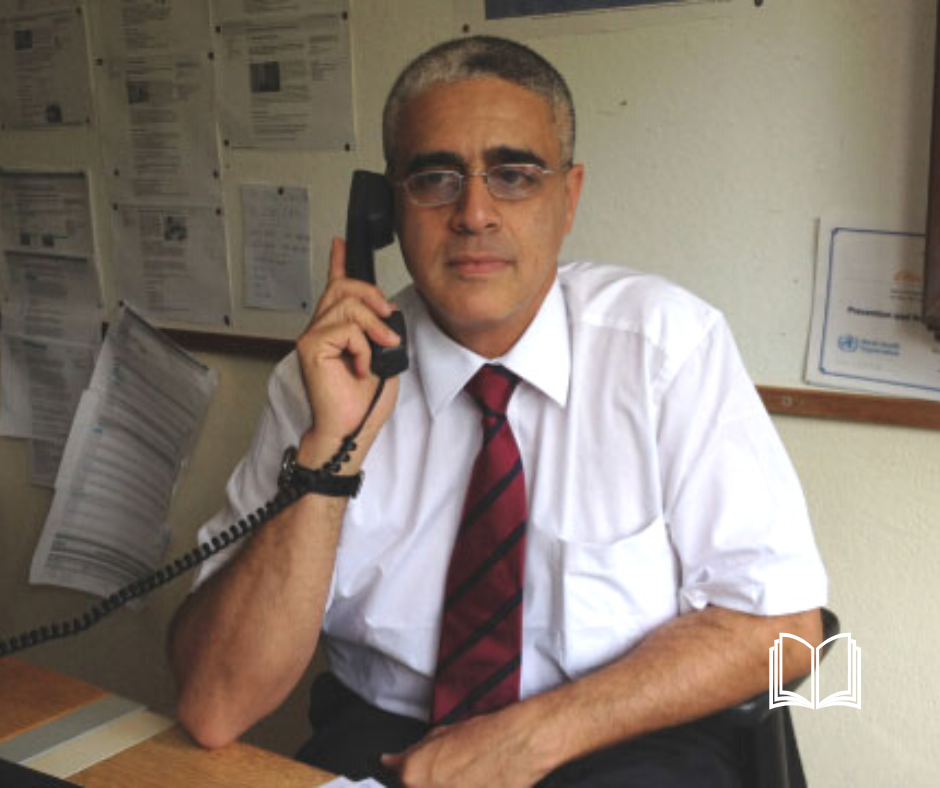 Somber business man, holding the phone to his ear.