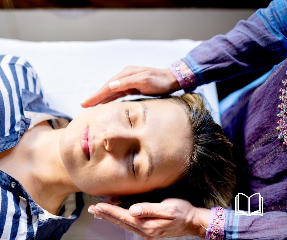 Healer's hands hovering on the side of a patient's head for healing.